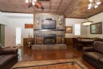 MAIN FLOOR FIREPLACE, TV & ROUND GAME/POKER TABLE